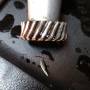 2010_1200x_oil_pump_gear_damage_3_by_lostndallas.jpg